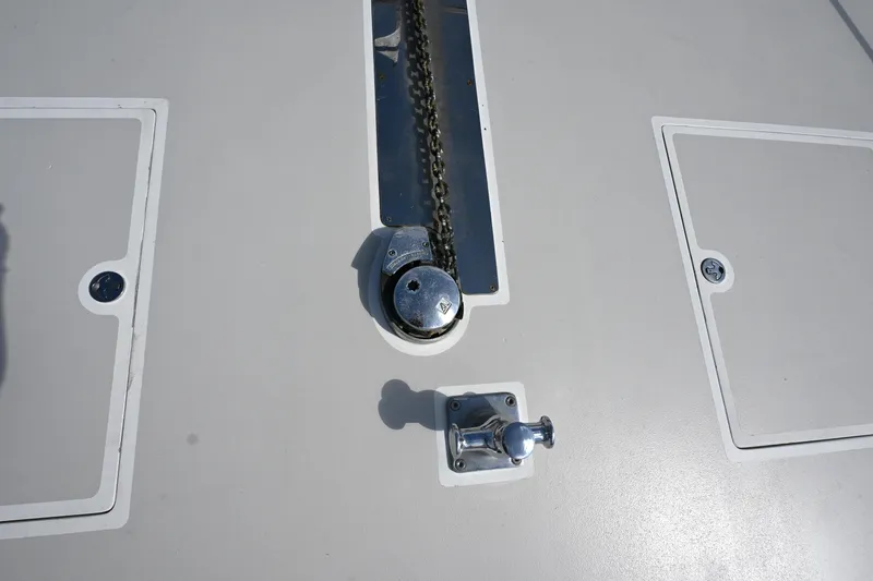 Slide: The Image of Anchor chain mechanism on 2002 Roger Hill Power Cat 41.4 boat deck. - 46