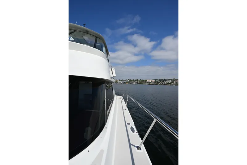 Slide: The Image of Side view of a 2002 Roger Hill Power Cat 41.4 on a sunny day at sea. - 57