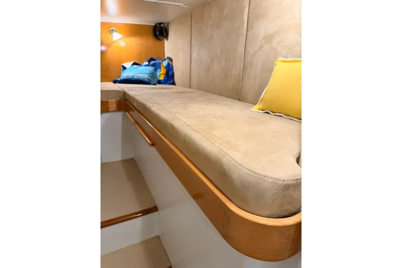Slide: The Image of Interior of 2002 Norris Custom Motor Catamaran 41.4 with beige seating and colorful cushions. - 88