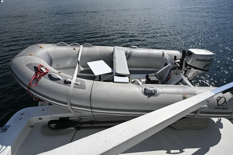 Slide: The Image of Inflatable Zodiac boat with Honda motor on Roger Hill Power Cat 41.4, 2002 model. - 30