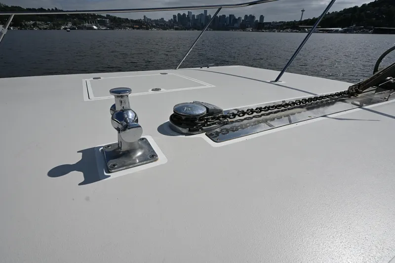 Slide: The Image of Deck of 2002 Roger Hill Power Cat 41.4 with anchor chain and skyline view. - 38