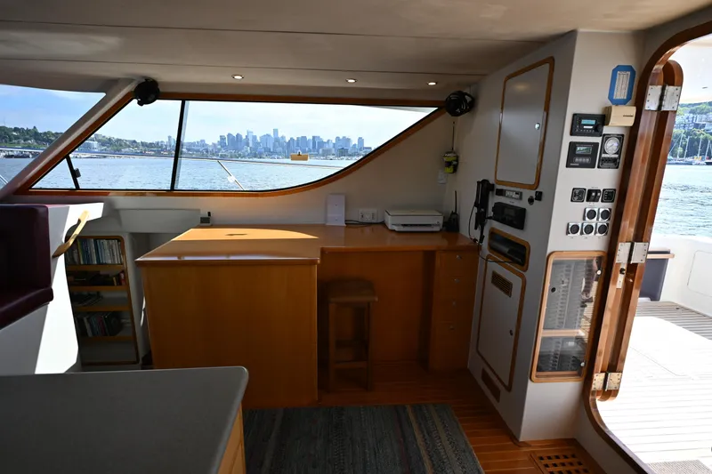 Slide: The Image of Interior of 2002 Roger Hill Power Cat 41.4 with city skyline view through windows. - 48
