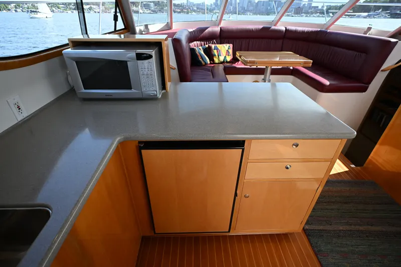 Slide: The Image of Luxurious 2002 Roger Hill Power Cat 41.4 interior with kitchen and seating area. - 53
