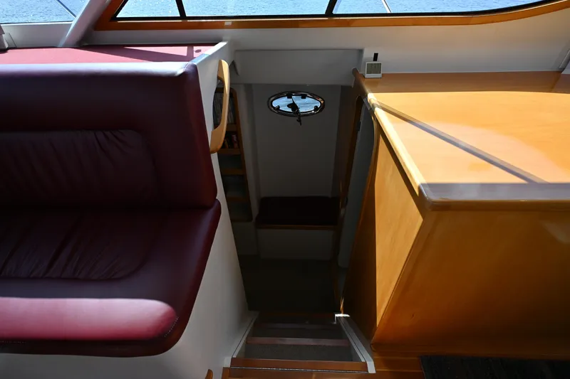 Slide: The Image of Interior of 2002 Roger Hill Power Cat 41.4, featuring stairs and seating area. - 72