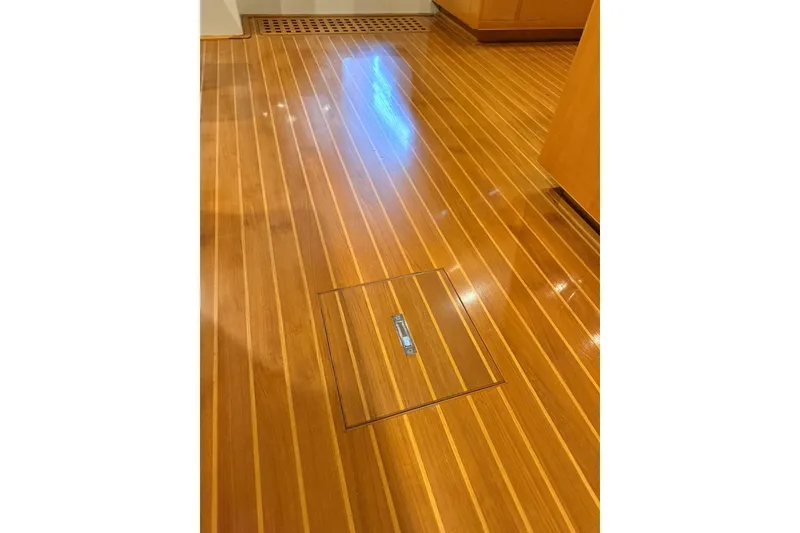 Slide: The Image of Polished wooden floor of 2002 Norris Custom Motor Catamaran 41.4, featuring sleek design. - 73