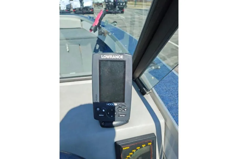 Slide: The Image of Lowrance fish finder on 1987 Blue Fin S170 boat dashboard. - 3