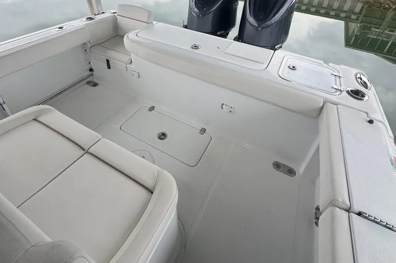 Slide: The Image of 2022 Sea Hunt Gamefish 27 Coffin Box boat interior with seating and storage. - 13
