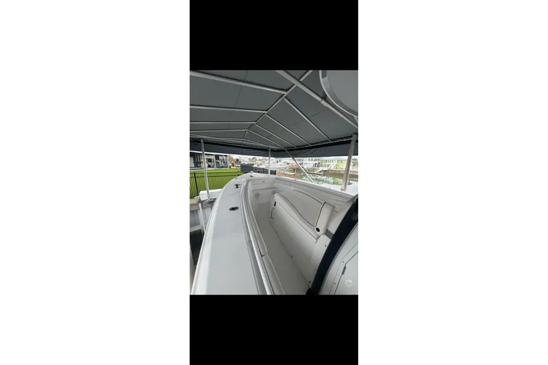 Slide: The Image of 2022 Sea Hunt Gamefish 27 Coffin Box boat interior under canopy. - 6