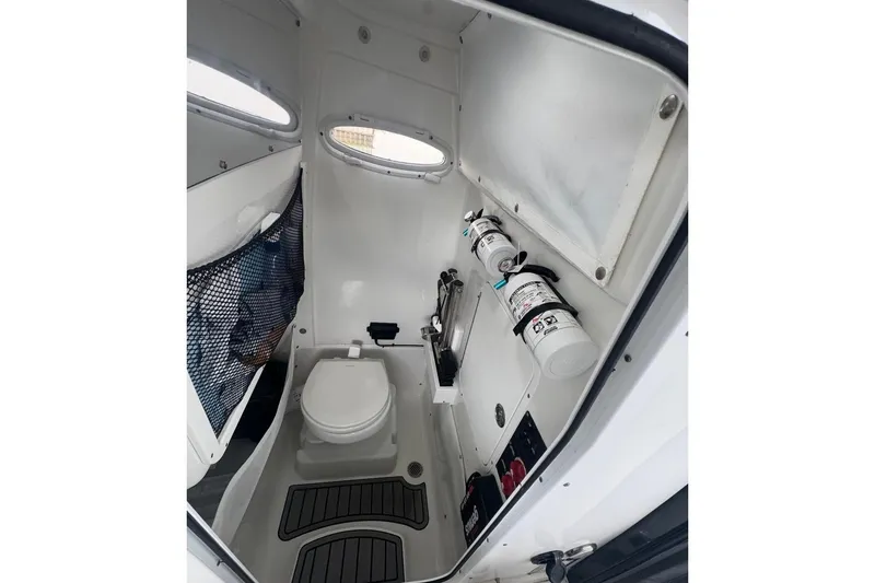 Slide: The Image of 2022 Sea Hunt Gamefish 27 Coffin Box interior with toilet and safety equipment. - 9