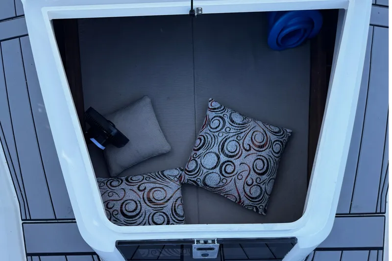 Slide: The Image of Cozy cabin interior of 2017 Axopar 37 Sun Top with decorative pillows. - 35