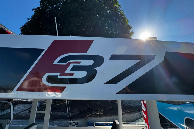 Slide: The Image of Axopar 37 Sun Top 2017 boat logo with sunlit background. - 45