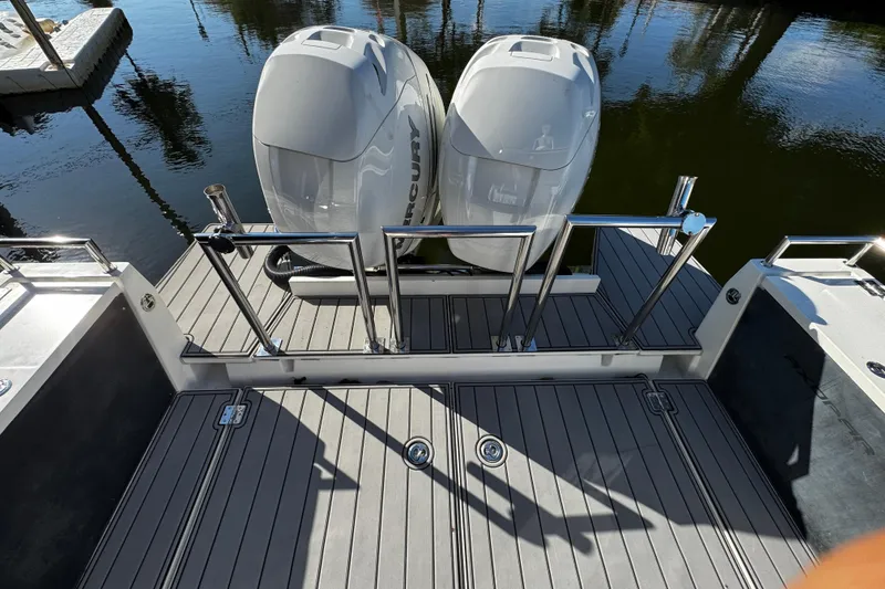 Slide: The Image of 2017 Axopar 37 Sun Top boat with dual Mercury outboard engines. - 7