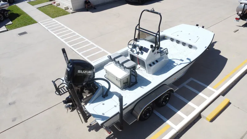 Slide: The Image of 2024 Majek 21RFL boat with Suzuki engine on trailer. - 15