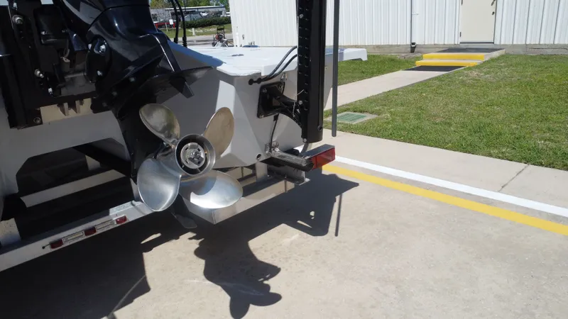 Slide: The Image of Rear view of a 2024 Majek 21RFL boat with propeller. - 21