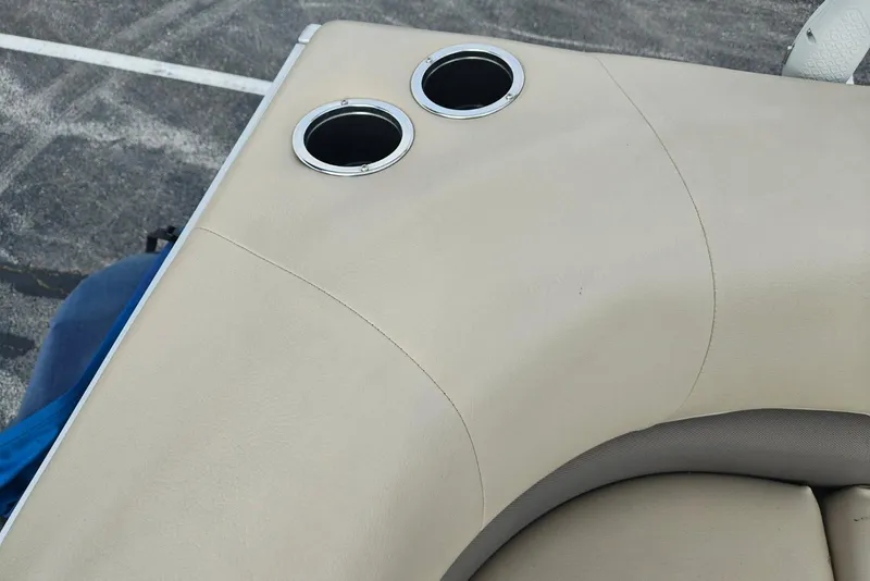 Slide: The Image of Beige seating with cup holders on 2020 Sun Tracker Party Barge 18 boat. - 16