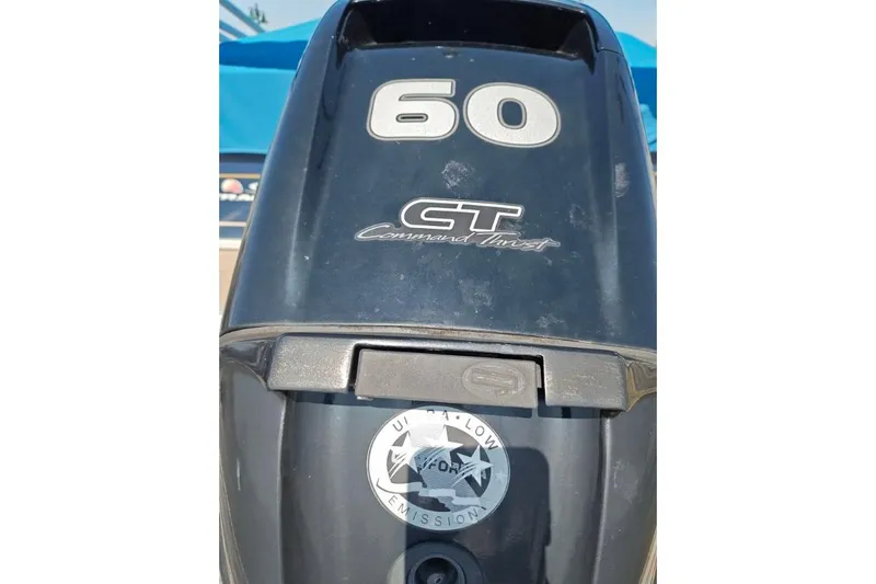 Slide: The Image of Outboard motor with "60 CT Command Thrust" branding on a 2020 SUNTRACKER pb18 boat. - 21