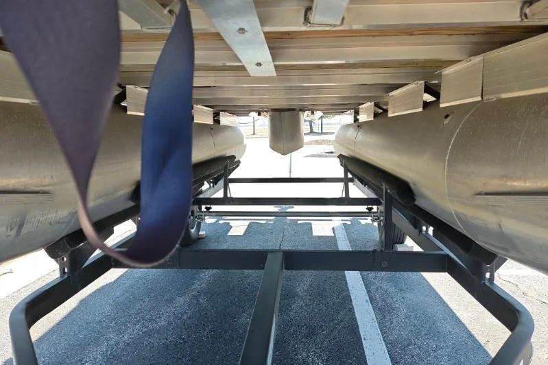 Slide: The Image of Underneath view of a 2020 SUNTRACKER pb18 pontoon boat on a trailer. - 5