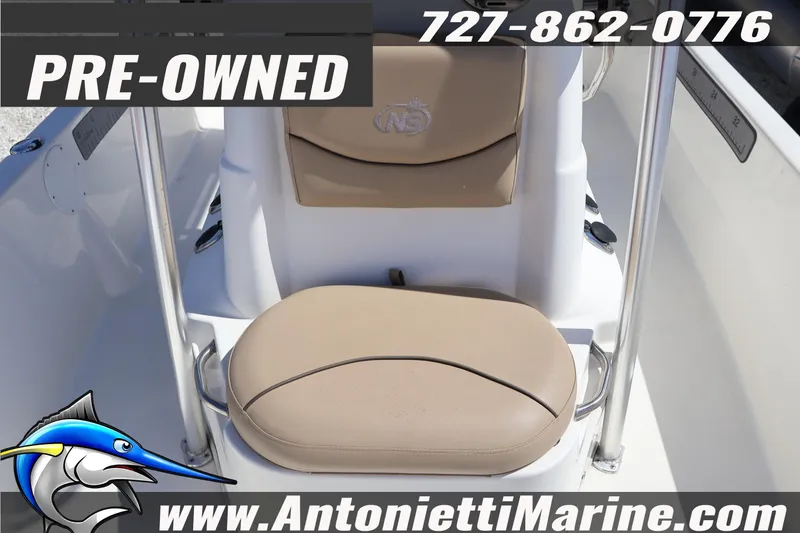 Slide: The Image of Pre-owned 2018 NauticStar 2140 Sport boat seat with contact details and logo. - 10