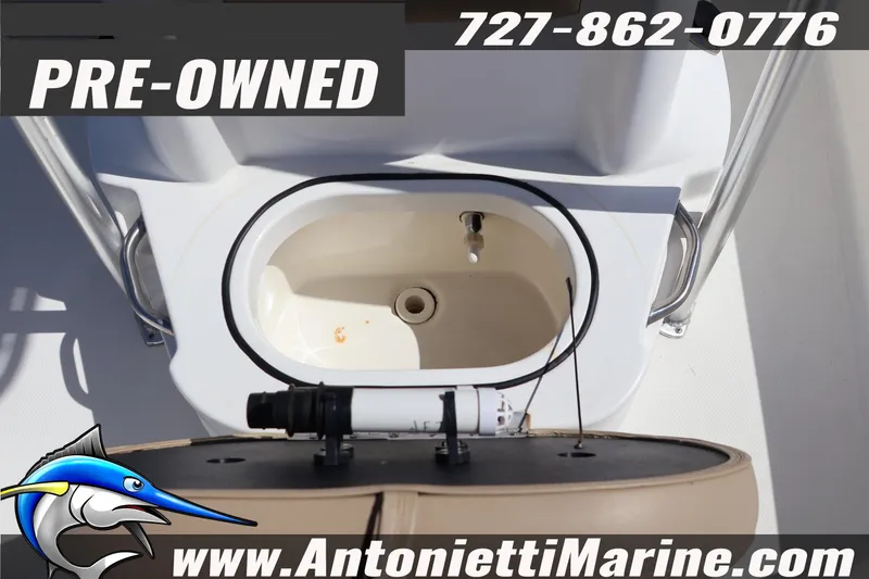 Slide: The Image of Pre-owned 2018 NauticStar 2140 Sport boat, featuring livewell and contact details. - 11
