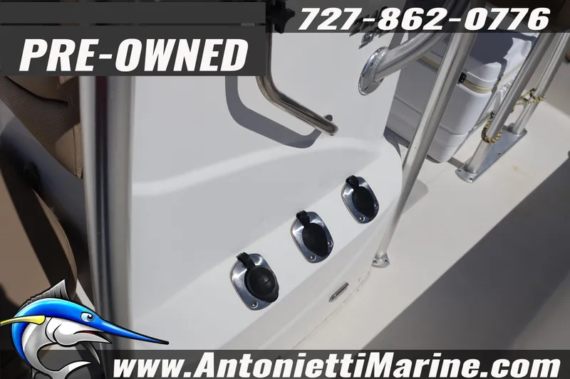 Slide: The Image of Pre-owned 2018 NauticStar 2140 Sport boat, featuring sleek design and sturdy railings. - 13