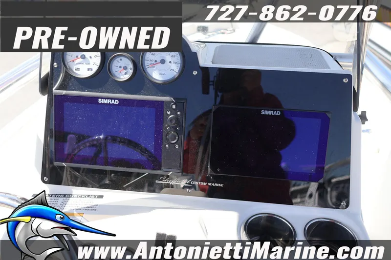 Slide: The Image of Pre-owned 2018 NauticStar 2140 Sport boat dashboard with Simrad displays. - 16