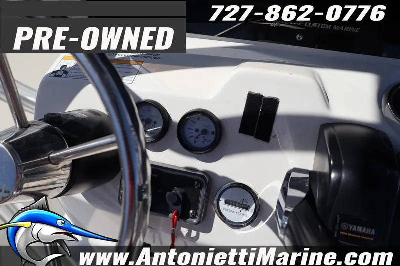 Slide: The Image of Pre-owned 2018 NauticStar 2140 Sport boat dashboard with gauges and controls. - 17