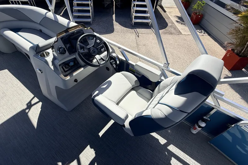 Slide: The Image of Luxurious 2026 Avalon 2585 Venture boat interior with modern helm and comfortable seating. - 20