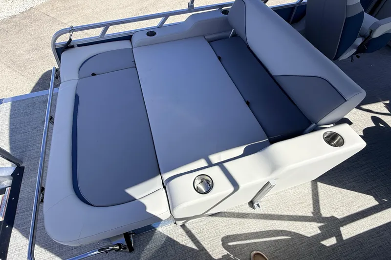 Slide: The Image of 2026 Avalon 2585 Venture 85 VRB boat seating area with cup holders and sleek design. - 22