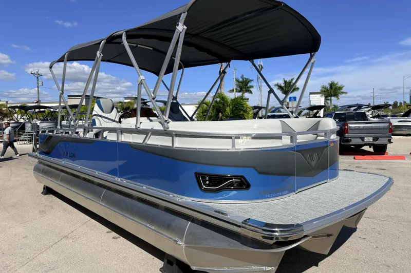 Slide: The Image of 2026 Avalon 2585 Venture 85 VRB Tri Toon boat with high-performance features, parked outdoors. - 5