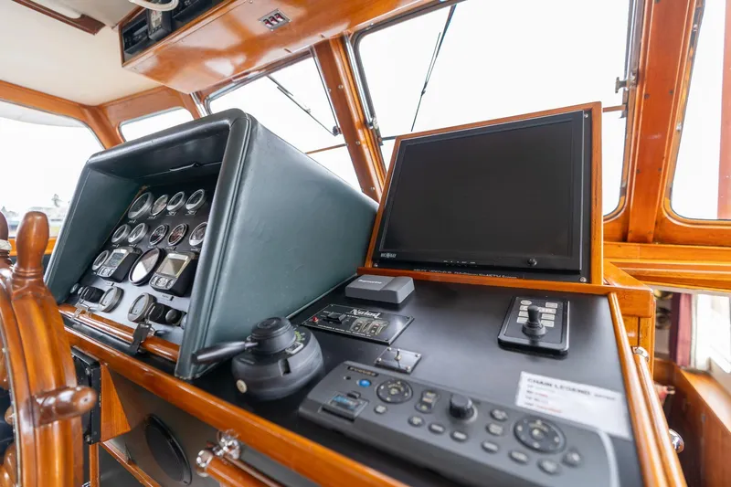 Slide: The Image of Cockpit of 1965 De Vries Lentsch 64 Motoryacht with navigation instruments and wooden steering wheel. - 10