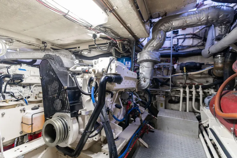 Slide: The Image of Engine room of a 1965 De Vries Lentsch 64 Motoryacht, showcasing mechanical components. - 100