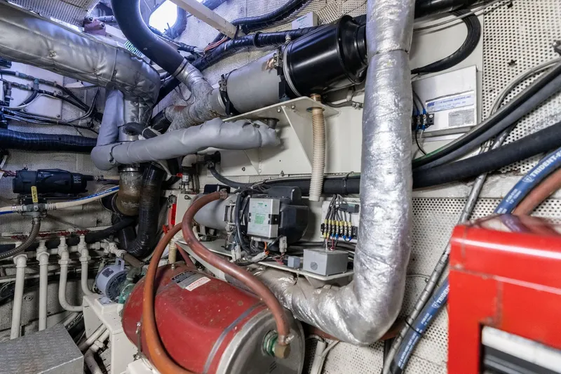 Slide: The Image of Engine room of 1965 De Vries Lentsch 64 Motoryacht with complex piping and machinery. - 102