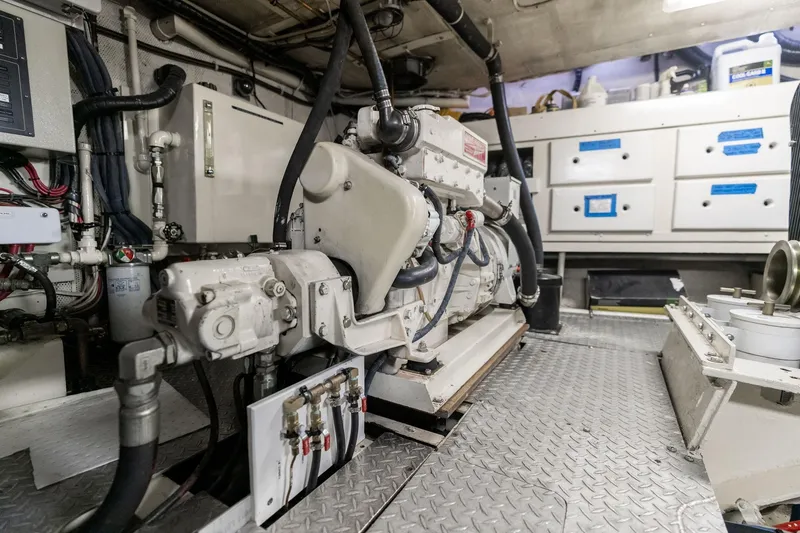 Slide: The Image of Engine room of a 1965 De Vries Lentsch 64 Motoryacht, showcasing machinery and equipment. - 103