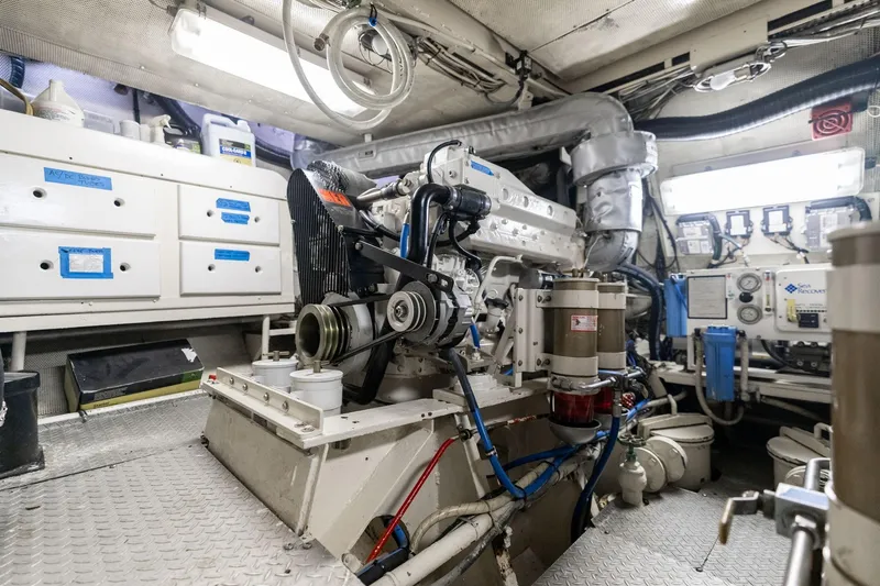 Slide: The Image of Engine room of a 1965 De Vries Lentsch 64 Motoryacht, showcasing machinery and equipment. - 104