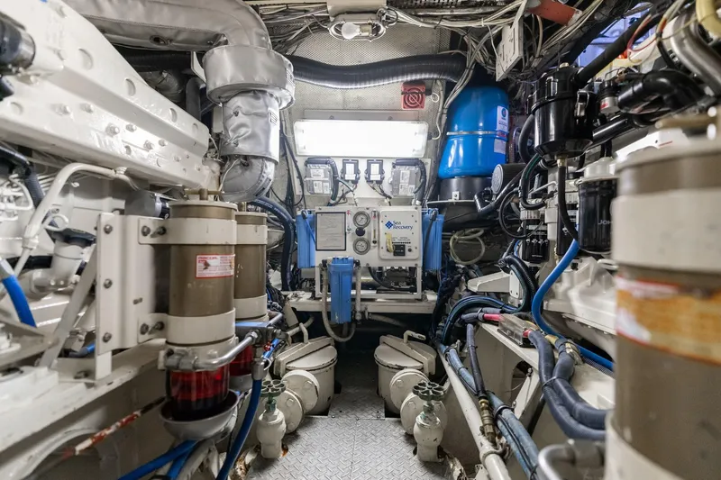 Slide: The Image of Engine room of a 1965 De Vries Lentsch 64 Motoryacht, showcasing mechanical components. - 106