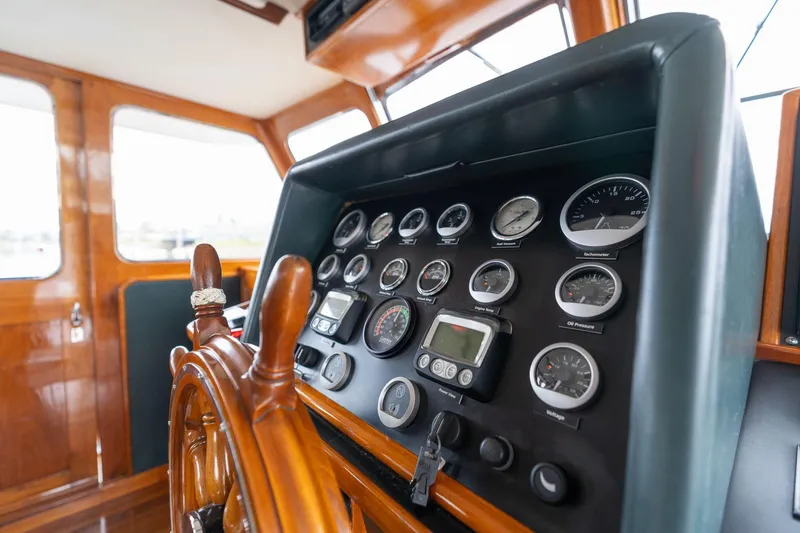 Slide: The Image of Helm of 1965 De Vries Lentsch 64 Motoryacht with gauges and wooden wheel. - 108