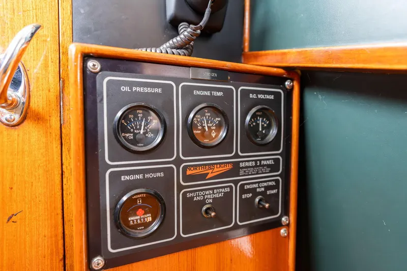 Slide: The Image of Control panel of a 1965 De Vries Lentsch 64 Motoryacht, featuring gauges and switches. - 109
