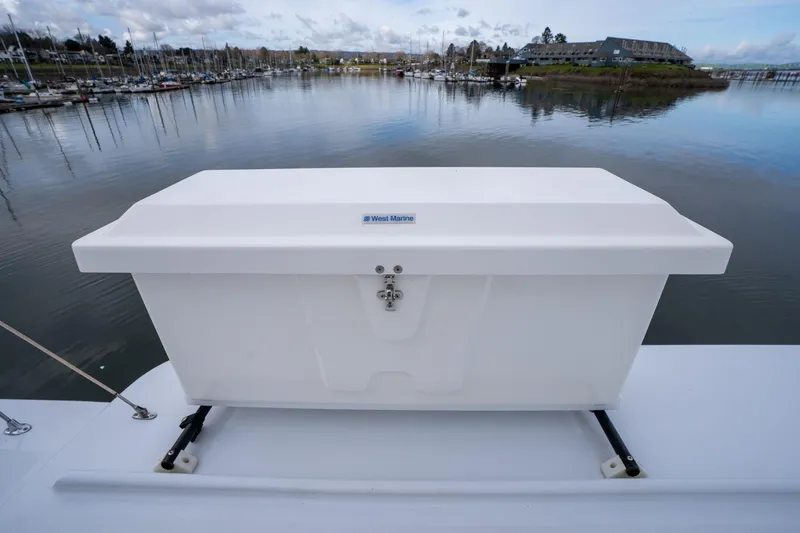 Slide: The Image of White storage box on De Vries Lentsch 64 Motoryacht, 1965, docked at marina. - 116