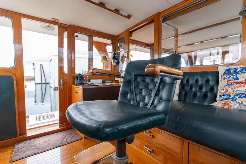 Slide: The Image of Interior of 1965 De Vries Lentsch 64 Motoryacht with leather seating and wooden accents. - 12