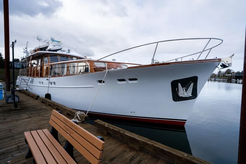 Slide: The Image of Classic 1965 De Vries Lentsch 64 Motoryacht docked by wooden pier. - 120
