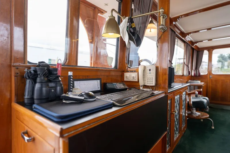 Slide: The Image of Interior of 1965 De Vries Lentsch 64 Motoryacht with wooden paneling and navigation equipment. - 15
