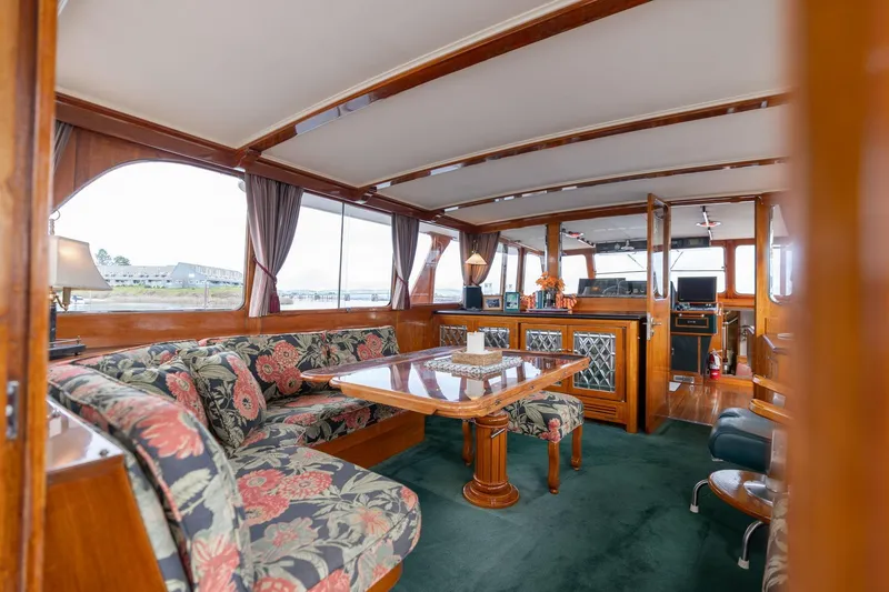 Slide: The Image of Luxurious interior of 1965 De Vries Lentsch 64 Motoryacht with floral upholstery and wooden accents. - 18