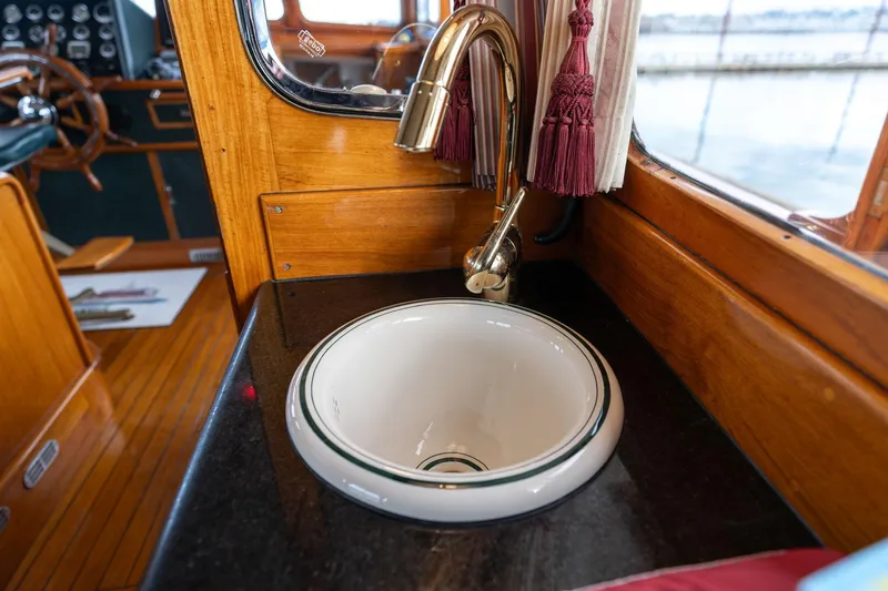 Slide: The Image of Vintage De Vries Lentsch 64 Motoryacht interior with elegant sink and wooden accents, 1965 model. - 23