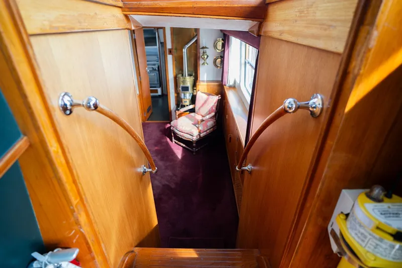 Slide: The Image of Interior of 1965 De Vries Lentsch 64 Motoryacht with wooden paneling and vintage decor. - 26