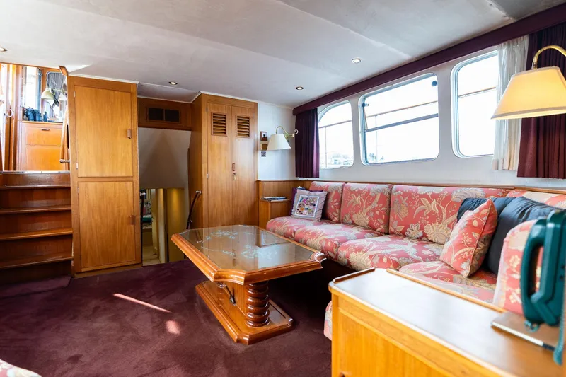 Slide: The Image of Interior of 1965 De Vries Lentsch 64 Motoryacht with floral upholstery and wooden furnishings. - 29