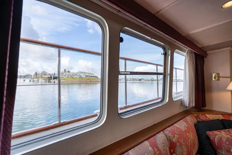 Slide: The Image of Interior view from a 1965 De Vries Lentsch 64 Motoryacht, showcasing scenic waterway. - 31
