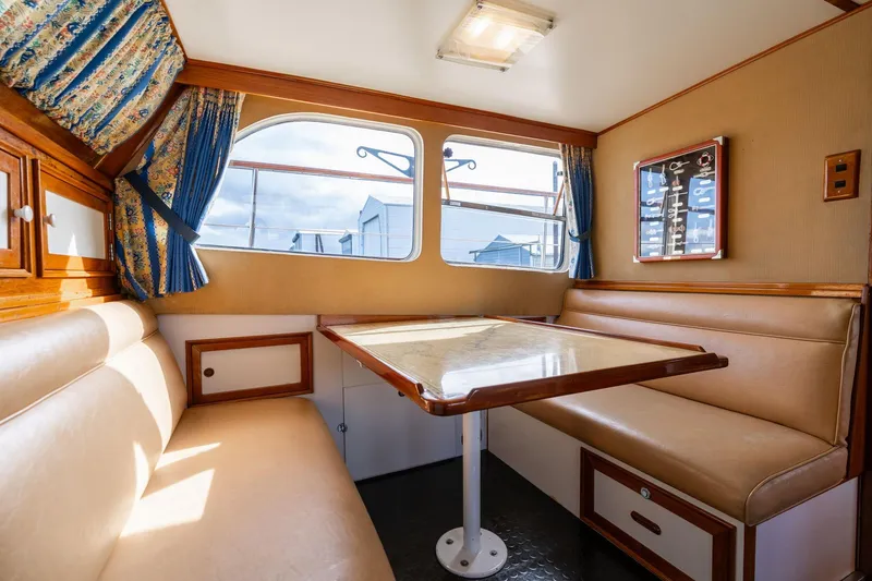 Slide: The Image of Interior of 1965 De Vries Lentsch 64 Motoryacht with cozy dining area and vintage decor. - 33