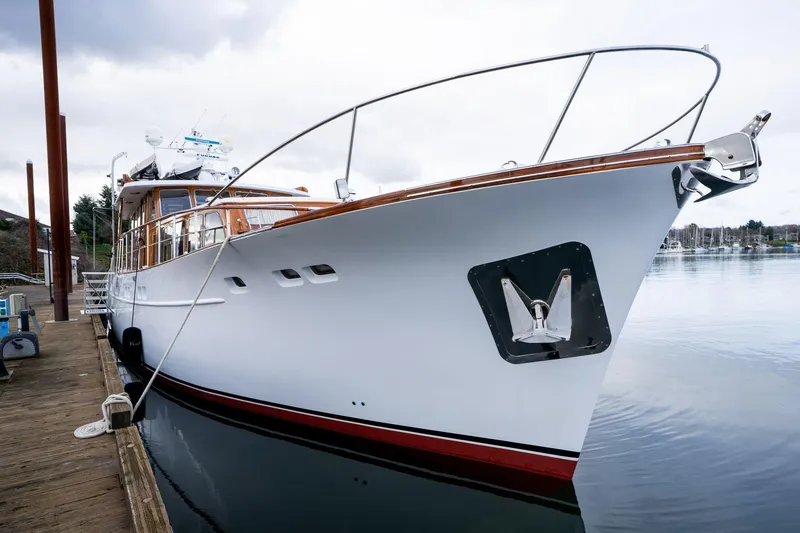Slide: The Image of 1965 De Vries Lentsch 64 Motoryacht docked, showcasing elegant design and craftsmanship. - 4