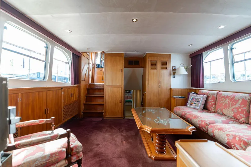Slide: The Image of Luxurious interior of 1965 De Vries Lentsch 64 Motoryacht with elegant wood paneling and plush seating. - 45
