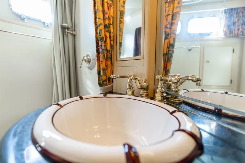 Slide: The Image of Vintage bathroom sink on 1965 De Vries Lentsch 64 Motoryacht with ornate fixtures. - 52